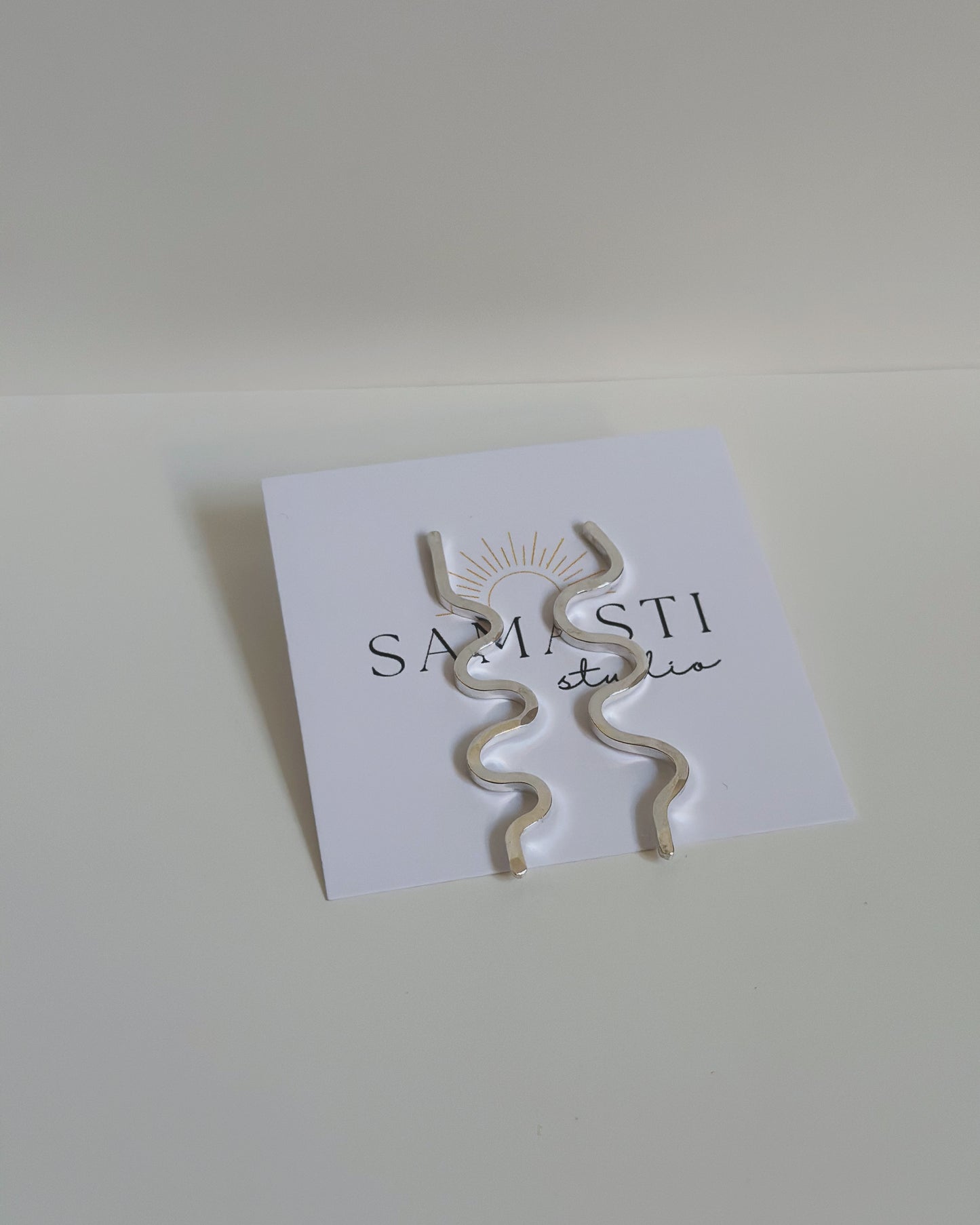 squiggle studs