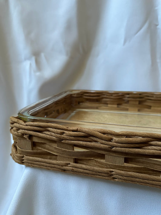 vintage pyrex baking dish with woven serving basket