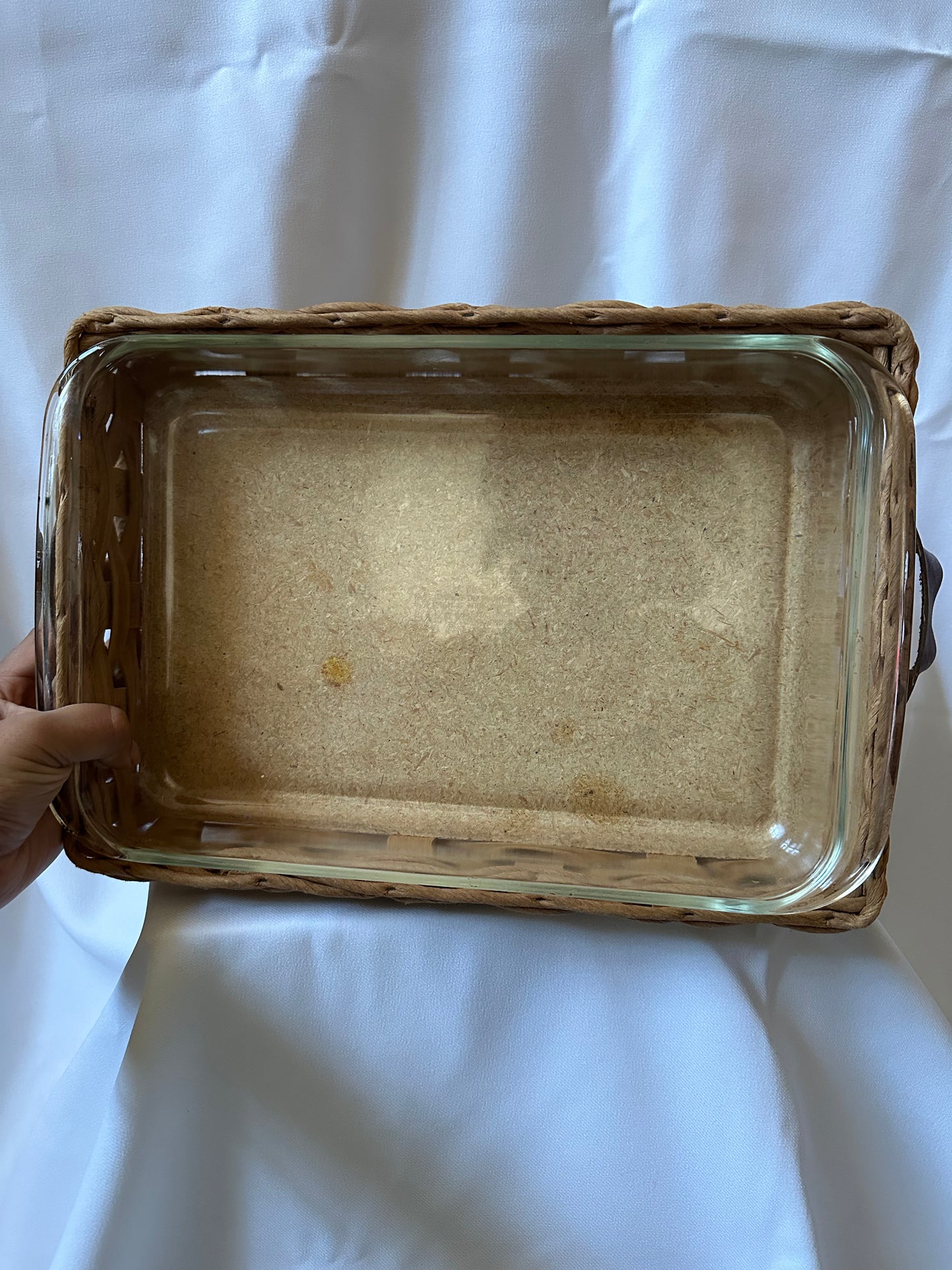 vintage pyrex baking dish with woven serving basket