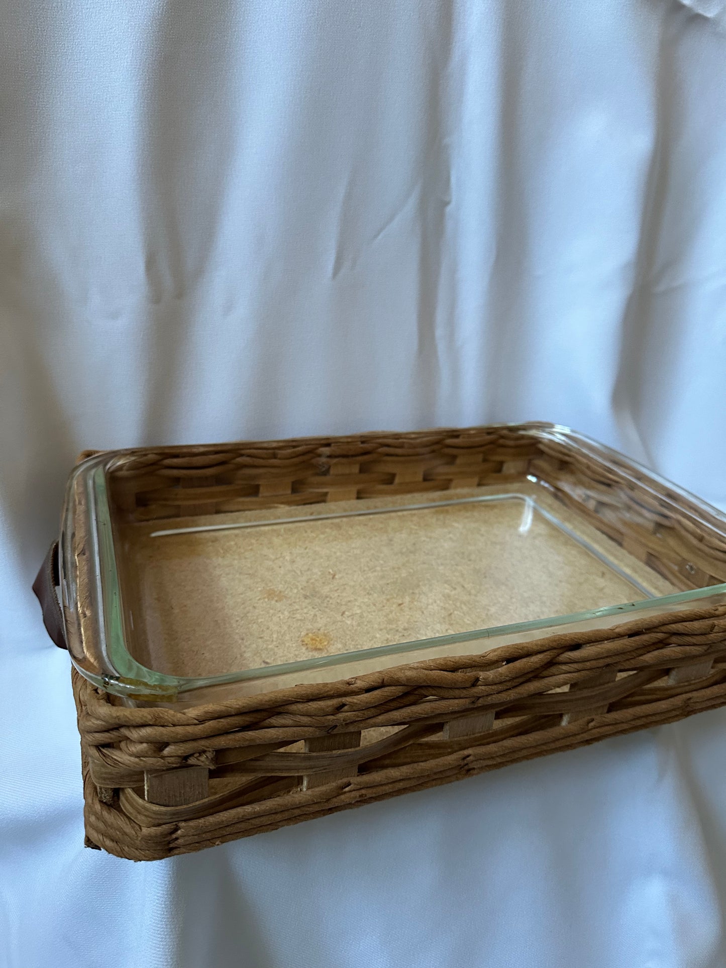 vintage pyrex baking dish with woven serving basket