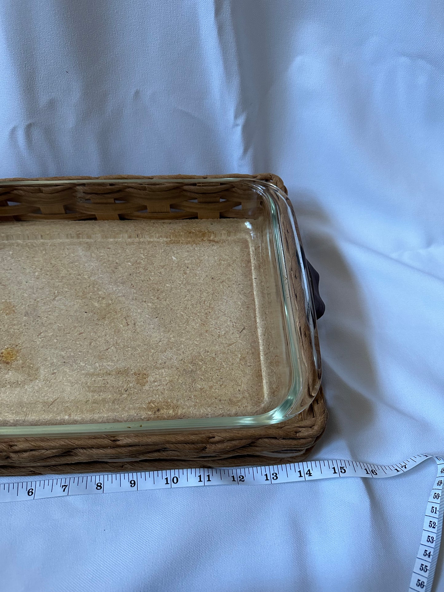 vintage pyrex baking dish with woven serving basket